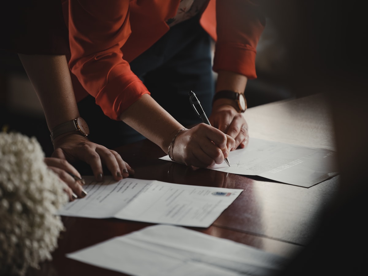 Filling in a registration form with a pen